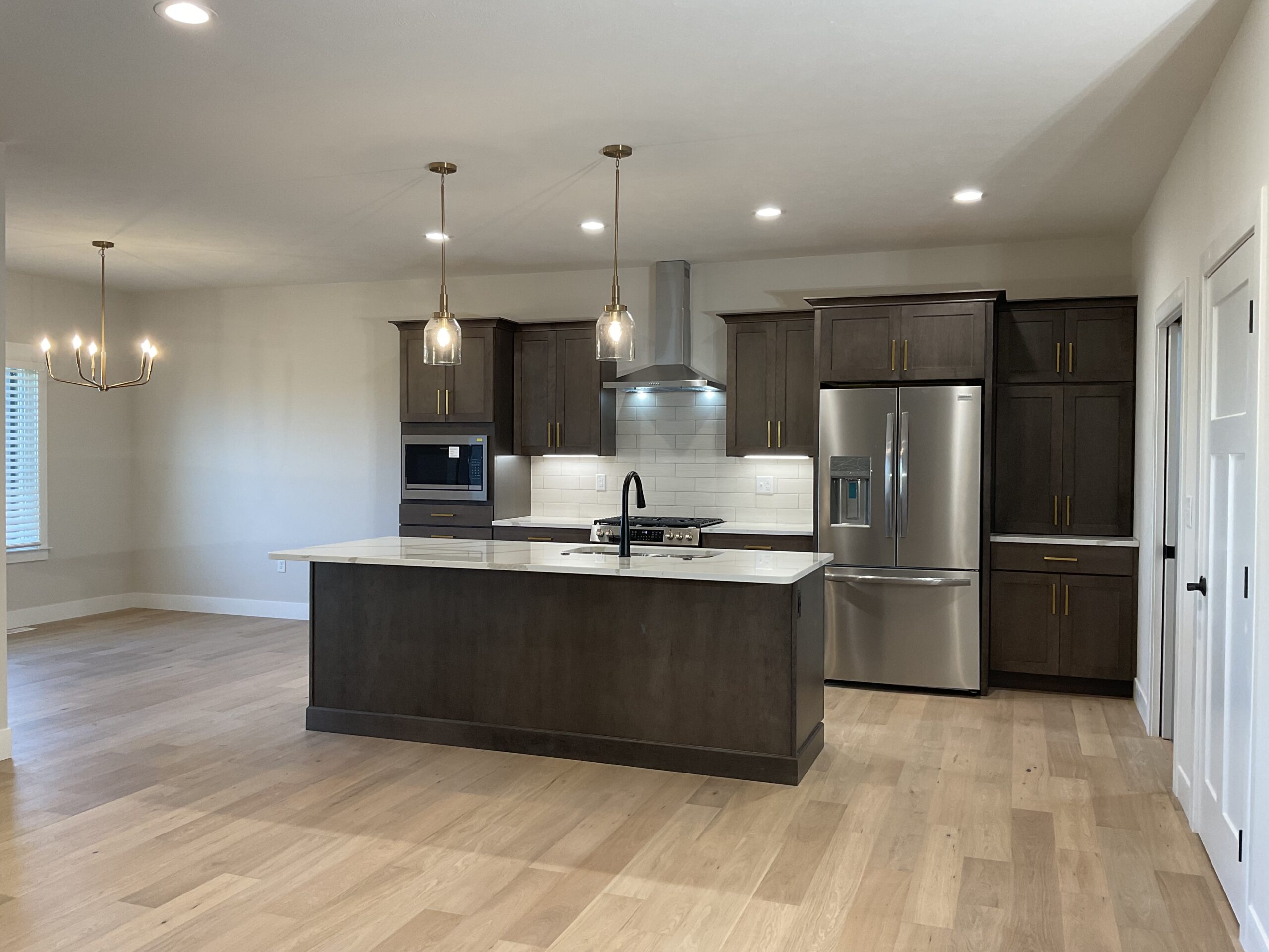 Kitchen with hardwood flooring and dining area