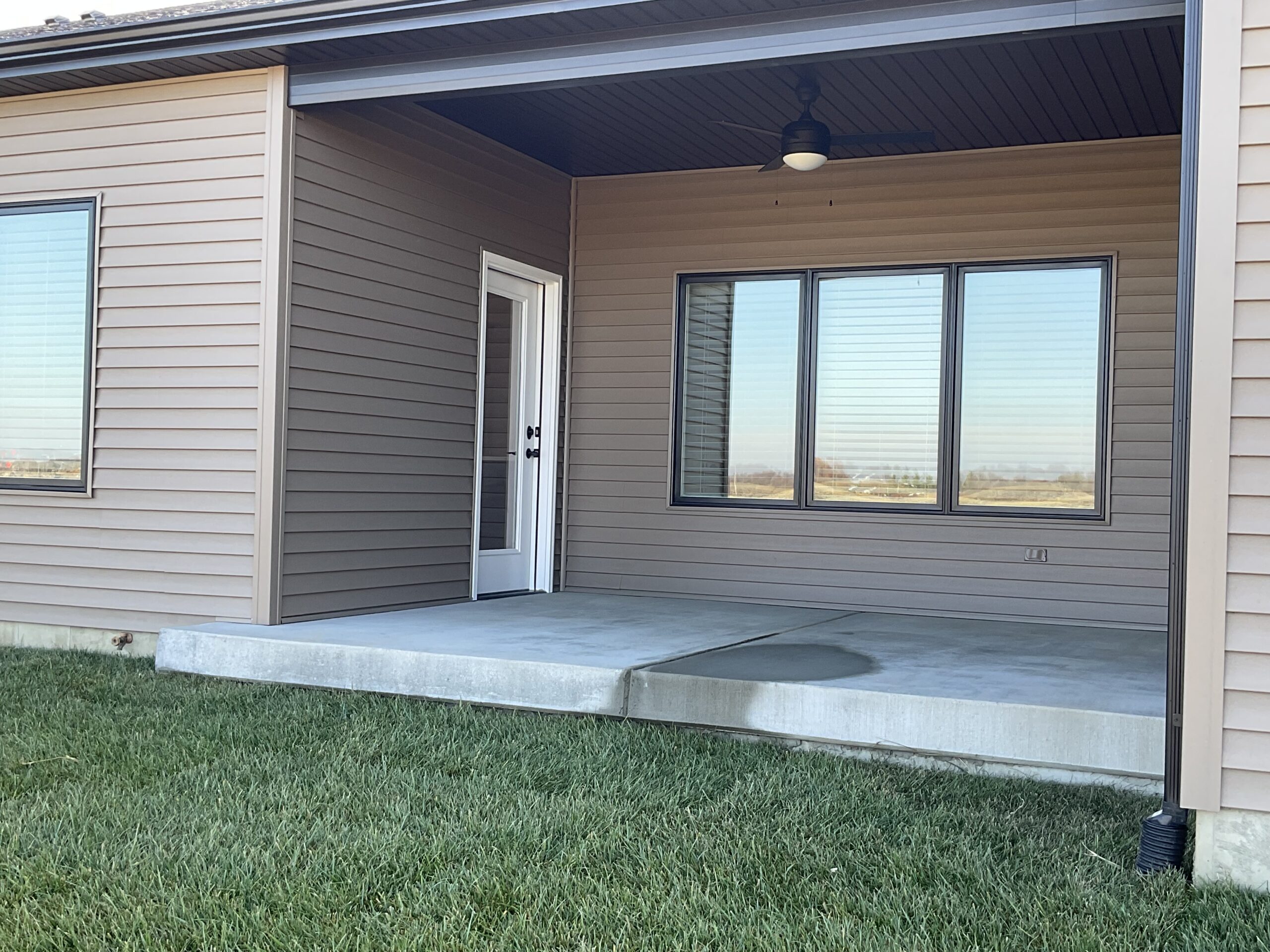 Covered Patio with ceiling light/fan. Can be enclosed.