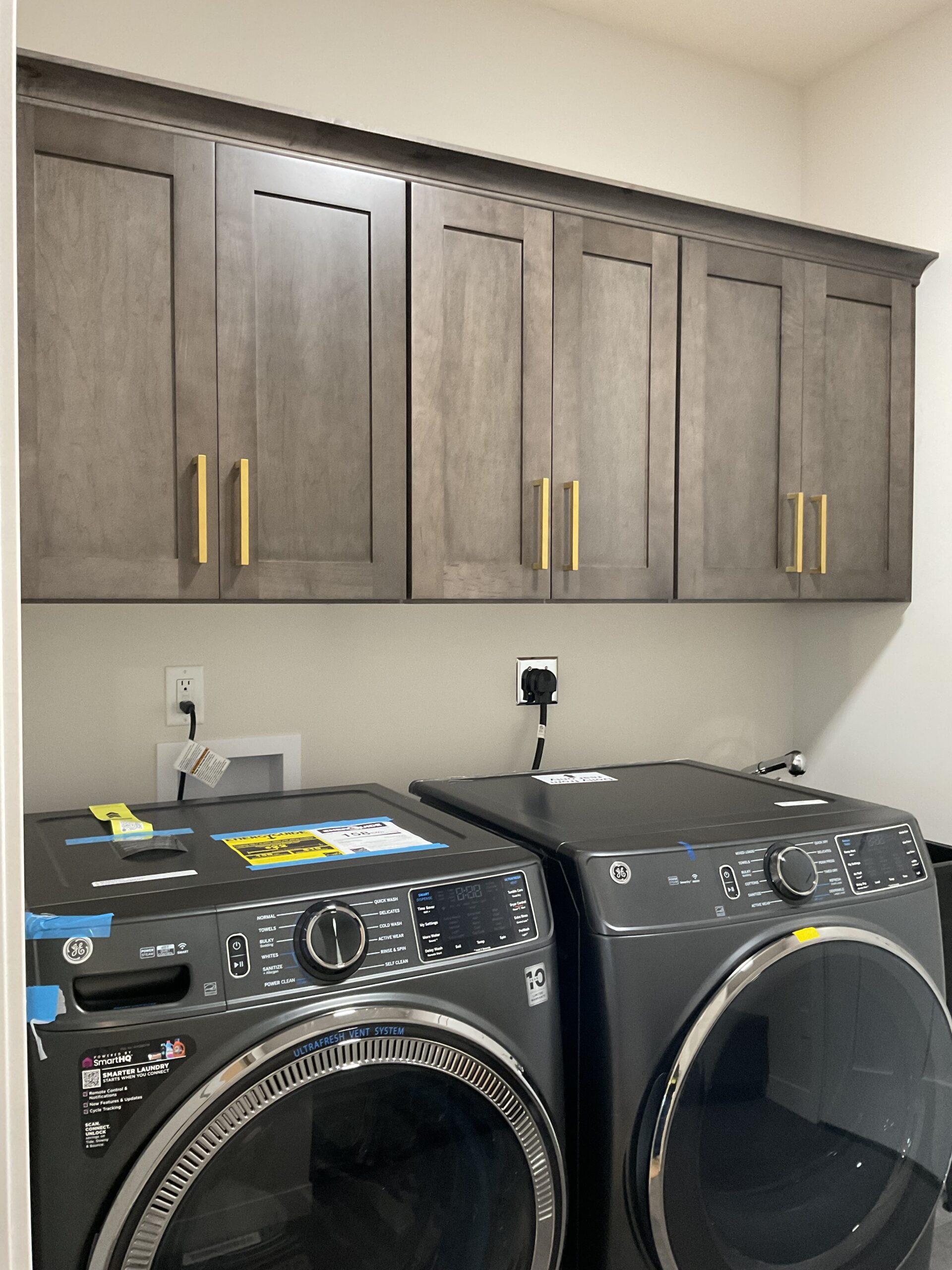 Laundry with upper cabinets